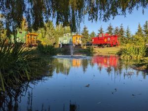 a view of a pond with a group of houses at Olympic Railway Inn in Sequim
