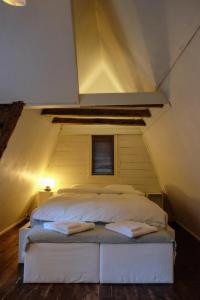 a bedroom with a bed in a attic at Charming Bergen house, rare historic house from 1779, Whole house in Bergen