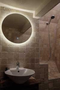 a bathroom with a sink and a mirror and a shower at Charming Bergen house, rare historic house from 1779, Whole house in Bergen