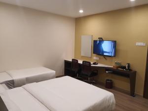Sjónvarps- og/eða afþreyingartæki á T SQUARE HOTEL (IPOH)
