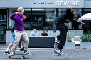 two young men are doing tricks on skateboards at Rewindhotel in Oostduinkerke