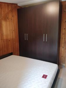 A bed or beds in a room at Appartamento nel verde adatto alle famiglie con CIN e RegLaz