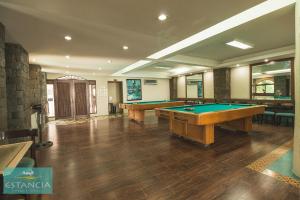 a large room with two pool tables in it at Estancia Resort Hotel in Tagaytay