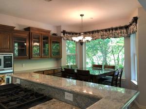 a kitchen with a table and a dining room at Entire lake house at Lake Fork with private bay, boat ramp, fishing light & 8 acres land in Alba