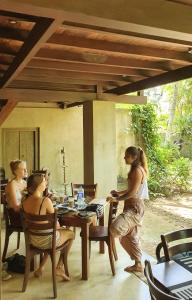 a group of people sitting at a table at Dunes Unawatuna Hotel in Unawatuna