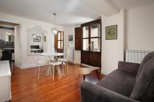 a living room with a couch and a table at Laila Home in Barbastro