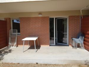 Balkón alebo terasa v ubytovaní appartement avec terrasse , jardinet et piscine