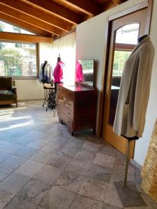 a room with a wooden dresser and a mirror at GlampingCashmereHause in Rivotorto 