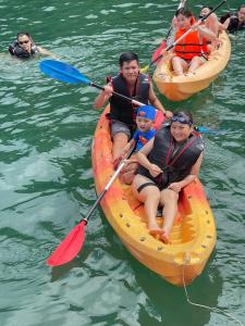 a group of people in kayaks on the water at Halong Bay Full Day Trip - 6 Hours Route in Ha Long