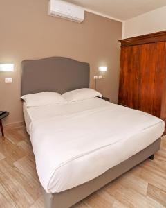 Postel nebo postele na pokoji v ubytování Hotel Villa Bonelli