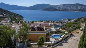 a house with a view of the water at Villa Grande Kalkan in Kaş