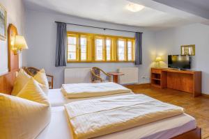 Postel nebo postele na pokoji v ubytování Watzdorfer Geleitschenke und Herberge