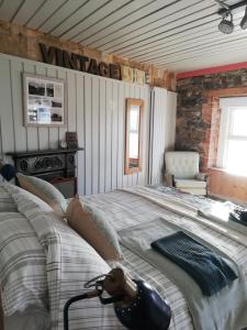 a bedroom with a large bed in a room at Shoe Trader's Terrace in Rathmullan