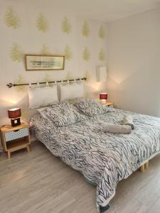 Postel nebo postele na pokoji v ubytování Gîte Camaloth - Closeries du Golfe