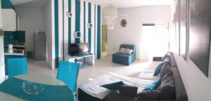a living room with a couch and a table at Apartment Tara in Sumartin