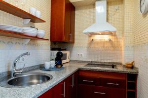 A kitchen or kitchenette at Bonito Callejón en la Judería by TheGoodTourist