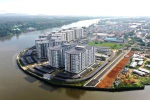 an aerial view of a city next to a river at Muji homestay kuching scenic view 2 bedrooms entire apartment in Kuching