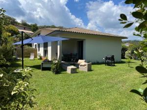a house with a lawn in front of it at Villa Talasani in Talasani