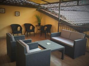 a patio with chairs and a table and chairs at Hotel Ciocca in Castelnuovo Don Bosco