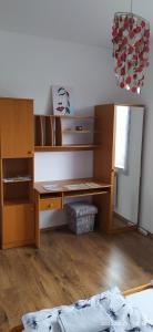 Postel nebo postele na pokoji v ubytování Barackos Apartman