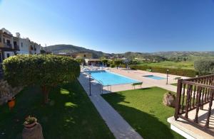 a view of a swimming pool in a yard at Bay Cottage Beautiful cosy luxury cottage - Beach area in Pissouri