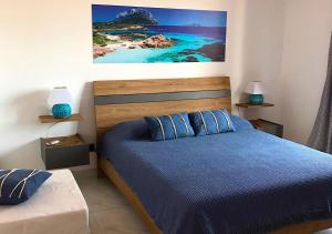 Postel nebo postele na pokoji v ubytování B&B I Colori Dell'Isola