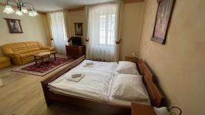 Posteľ alebo postele v izbe v ubytovaní Pension Pod Radnicí