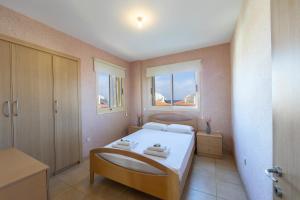 Postel nebo postele na pokoji v ubytování Pelagos apartment 6