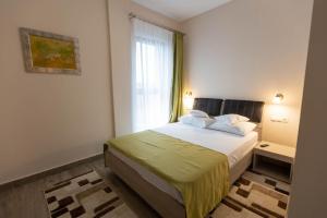 Postel nebo postele na pokoji v ubytování Hotel Nicoleta