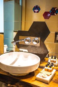 a bathroom with a white sink on a counter at West Pera Hotel in Istanbul