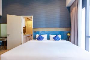 Postel nebo postele na pokoji v ubytování Star Suites KLCC + 77 fotografií