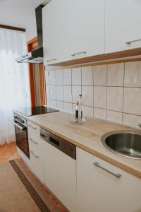 a kitchen with a sink and a counter top at I&T apartman in Gospić