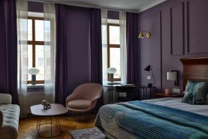 Postel nebo postele na pokoji v ubytování Leopolis Hotel