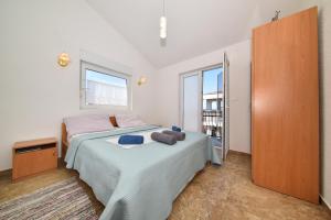 Posteľ alebo postele v izbe v ubytovaní Apartments Zrakic