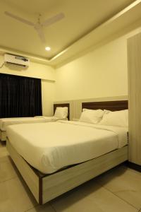 Hotel Sigma Suites客房内的一张或多张床位