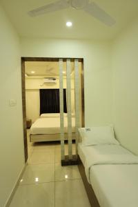 Hotel Sigma Suites客房内的一张或多张床位