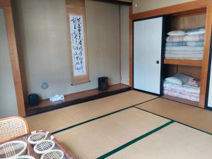 Palanda nebo palandy na pokoji v ubytování Matsuo House - Max 4 person Room Natsu
