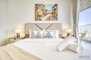 Postel nebo postele na pokoji v ubytování Delightful 2BR at Bloom Heights B JVC by Deluxe Holiday Homes