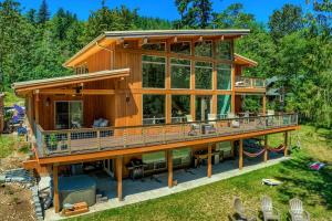 a large wooden house with a large deck at Angels Rest B&B Lavender Farm in Skamania