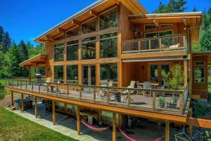 a large wooden house with a large deck at Angels Rest B&B Lavender Farm in Skamania