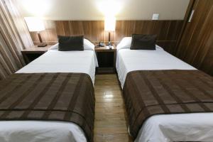 Ein Bett oder Betten in einem Zimmer der Unterkunft Casablanca Center Hotel