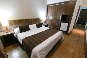 Ein Bett oder Betten in einem Zimmer der Unterkunft Casablanca Center Hotel