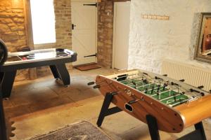 a room with a pool table and a foos ball at Vivers Mill in Pickering