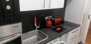 Kuchyňa alebo kuchynka v ubytovaní Apartment Jakubská 676