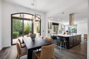 a kitchen and dining room with a table and chairs at Amazing Luxury Home with Hot Tub & Views in Sedona