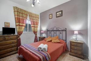Säng eller sängar i ett rum på Casa Manoli Chiclana