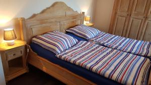Ein Bett oder Betten in einem Zimmer der Unterkunft Ferienwohnungen Brasse