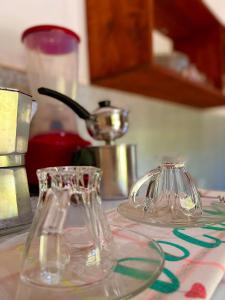 two glass containers sitting on a kitchen counter at Residencial Bem-te-vi in Jericoacoara