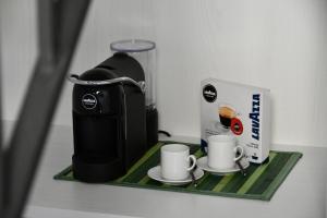 Příslušenství pro přípravu čaje a kávy v ubytování La casa del tempo - Urban resort