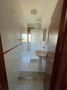 a bathroom with a sink and a shower at limoneto in Trabia